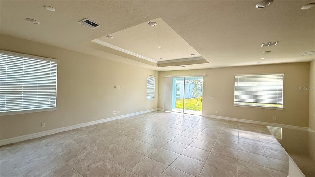 1530 Groveline Road St. Cloud, FL 34771 - Photo 6 of 18 a view of an empty room with a window