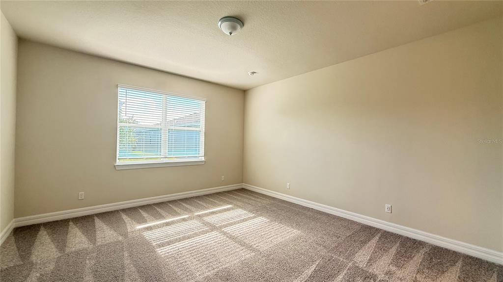 1530 Groveline Road St. Cloud, FL 34771 - Photo 9 of 18 a view of an empty room with a window