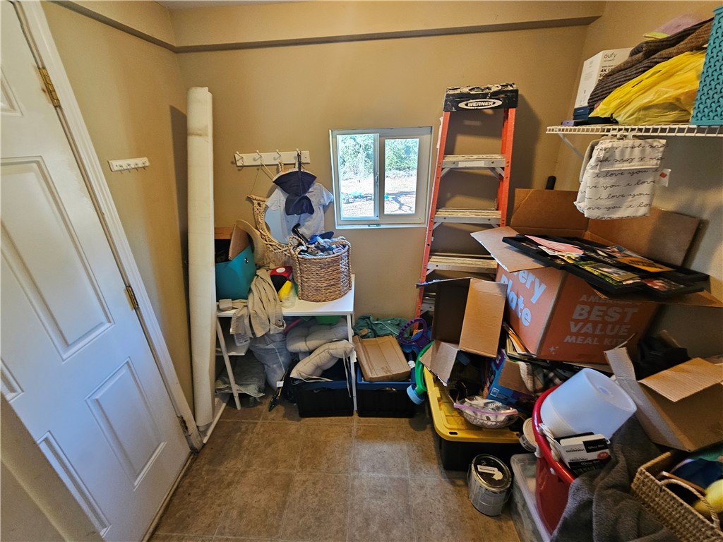 237 Pine Lane Anderson, SC 29621 - Photo 23 of 23 This versatile utility space offers practical storage solutions with durable tile flooring and natural light.