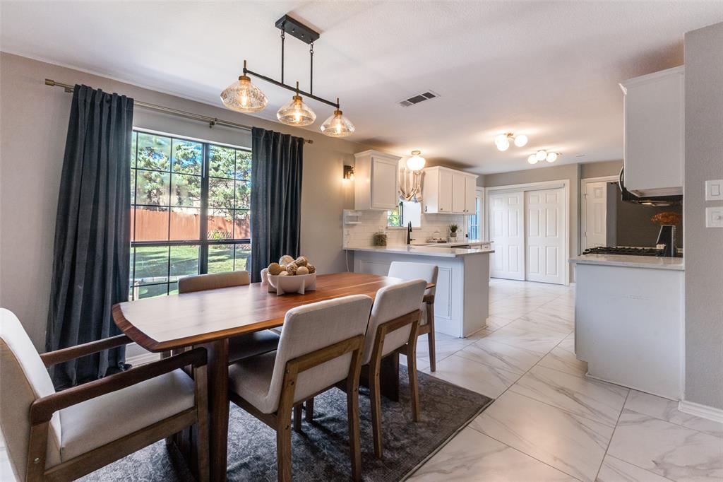 8209 Weatherly Drive Rowlett, TX 75089 - Photo 12 of 25 a view of a dining room with furniture window and outside view