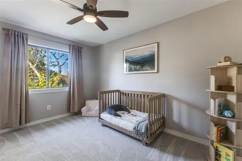 a bedroom with furniture and a window