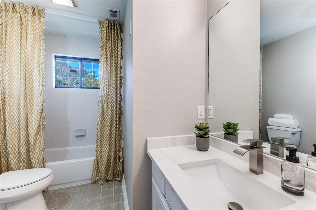 8209 Weatherly Drive Rowlett, TX 75089 - Photo 18 of 25 a bathroom with a sink a toilet and shower