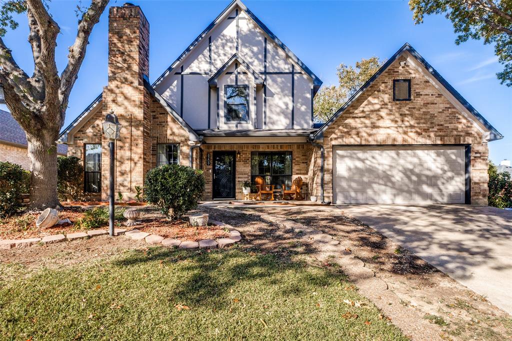 8209 Weatherly Drive Rowlett, TX 75089 - Photo 6 of 25 a view of a building with a large windows