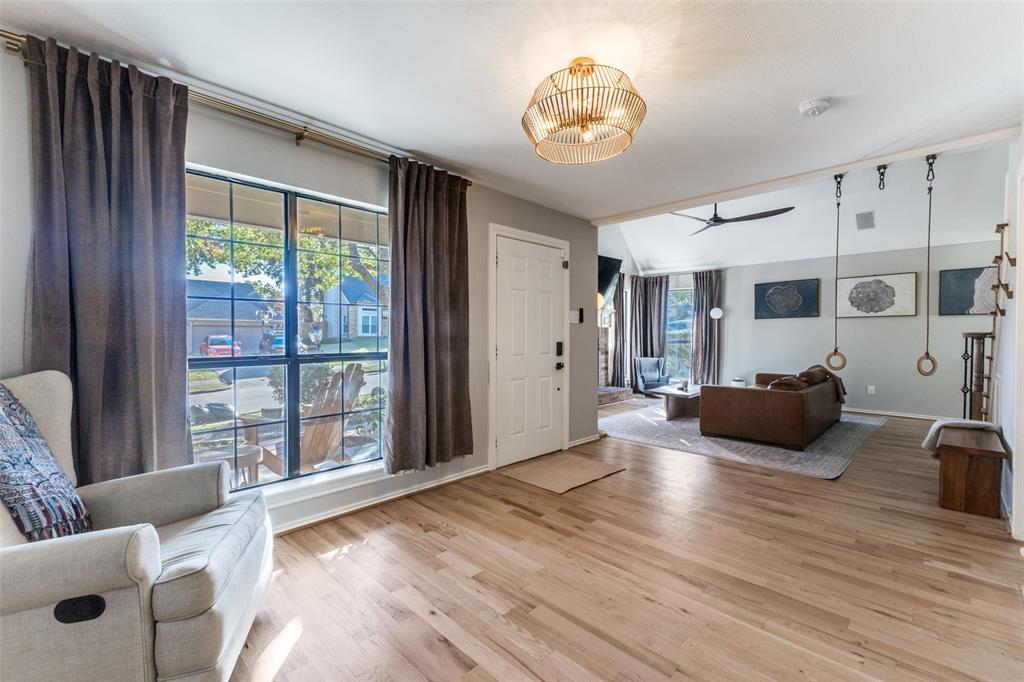 8209 Weatherly Drive Rowlett, TX 75089 - Photo 9 of 25 a view of a livingroom with furniture wooden floor and windows