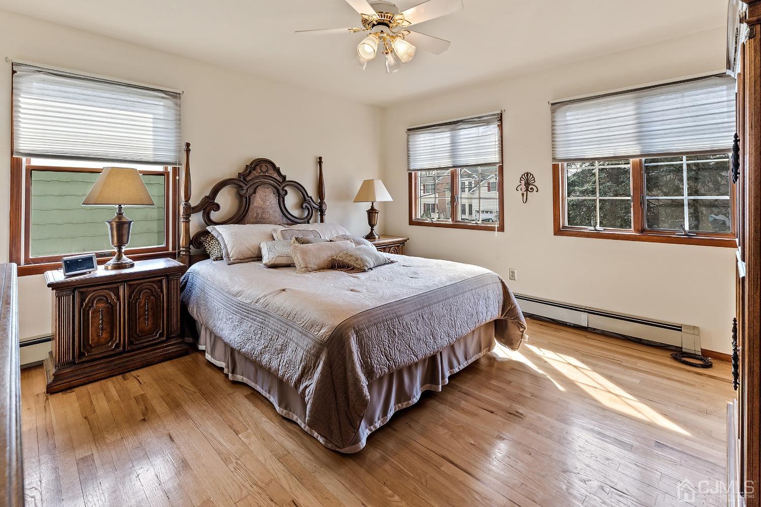 121 Harding Avenue Edison, NJ 08820 - Photo 20 of 30 a bedroom with a bed and wooden floor
