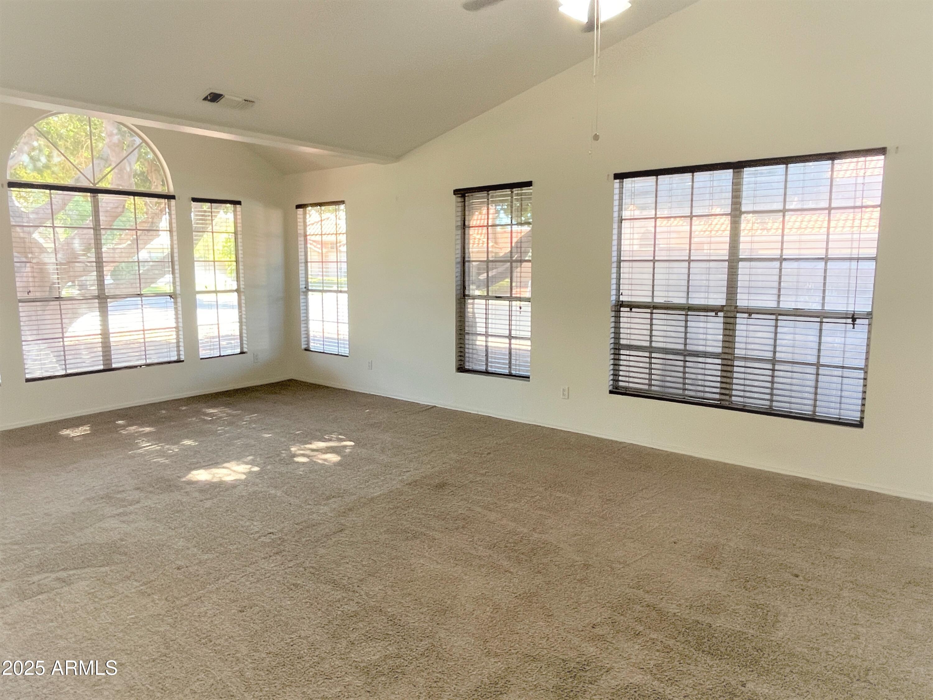 1310 North Longmore Street Chandler, AZ 85224 - Photo 2 of 32 a view of an empty room with a window