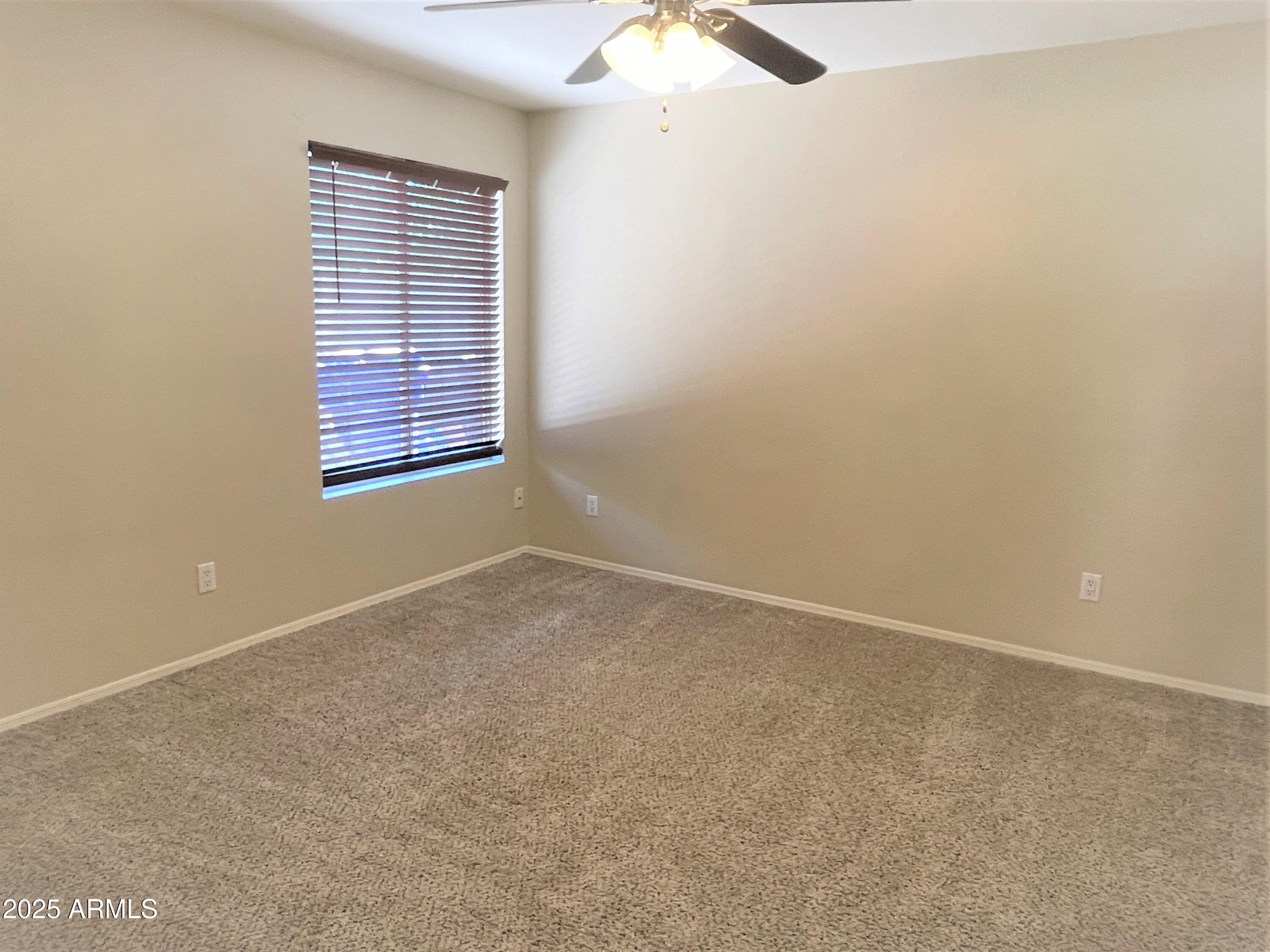 1310 North Longmore Street Chandler, AZ 85224 - Photo 21 of 32 an empty room with a window