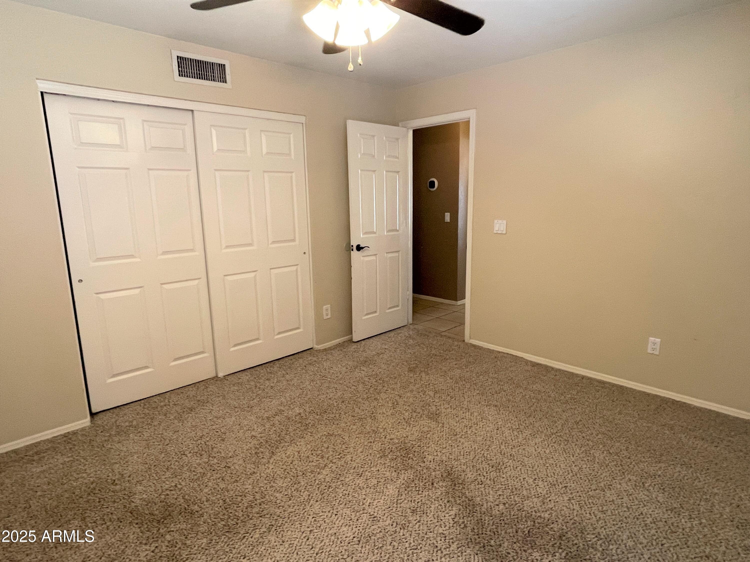 1310 North Longmore Street Chandler, AZ 85224 - Photo 22 of 32 an empty room with fan