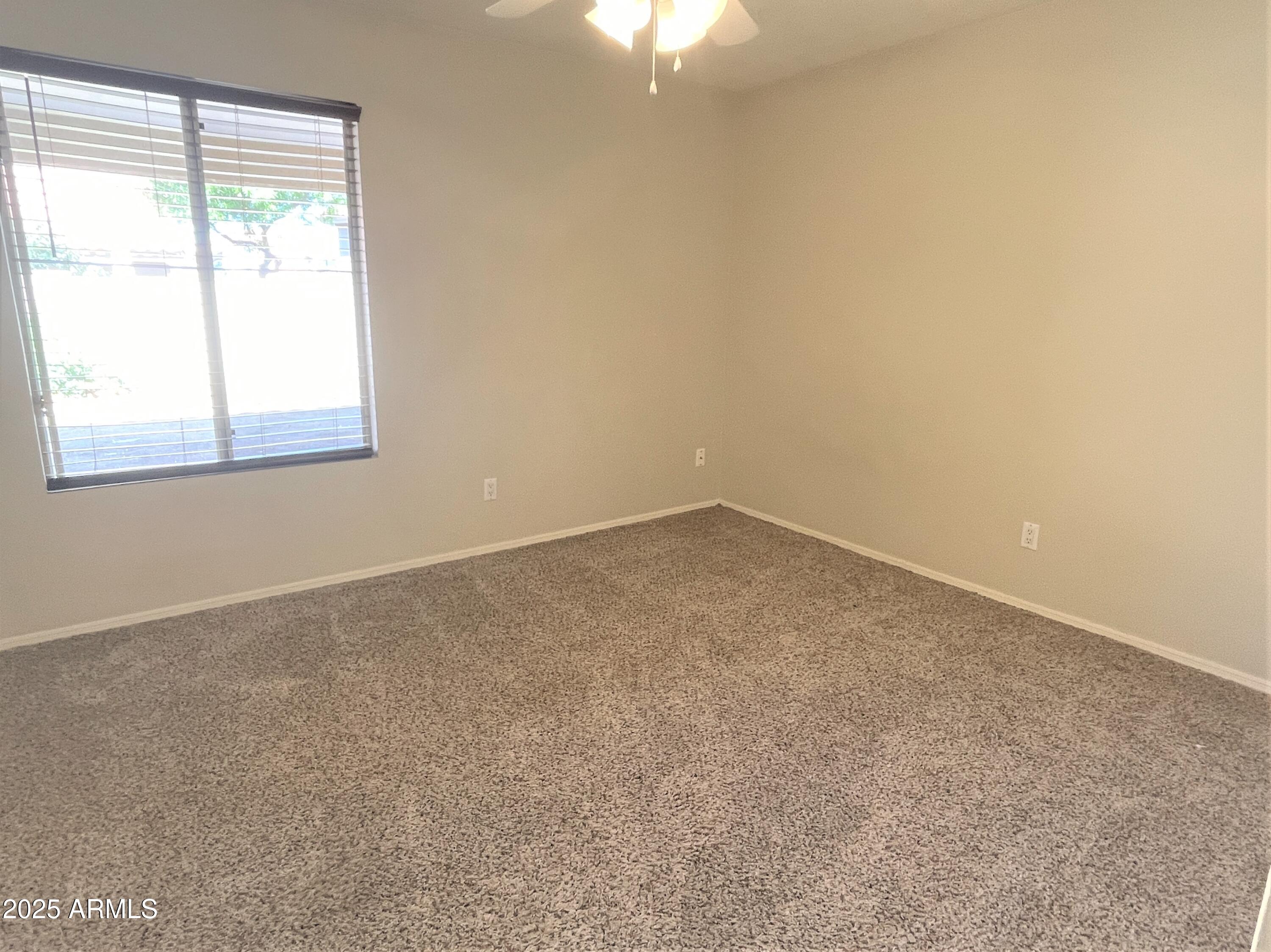 1310 North Longmore Street Chandler, AZ 85224 - Photo 25 of 32 an empty room with a window