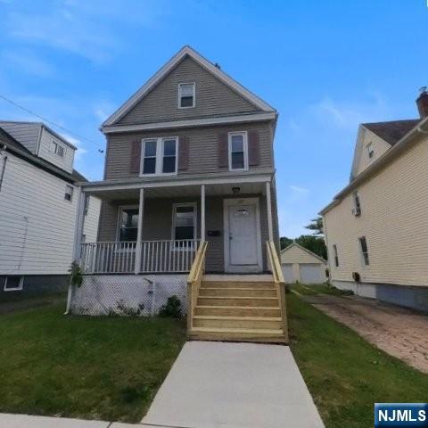 167 James Street Hackensack, NJ 07601 - Photo 1 of 30 a front view of a house with a yard