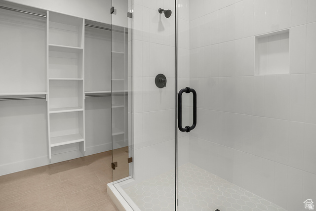 1631 West Century Lane, Unit C Mapleton, UT 84664 - Photo 21 of 31 Shower with glass enclosure, white rectangular wall tiles, and hexagonal floor tiles