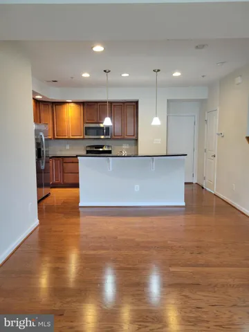 a view of kitchen with wooden floor