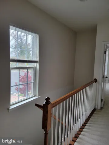 a view of hallway with a window