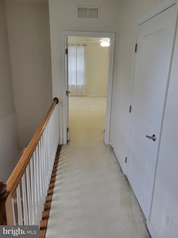 a view of hallway with stairs