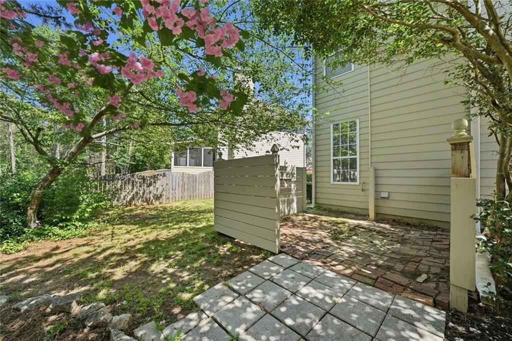 3318 Ridgemill Circle Dacula, GA 30019 - Photo 38 of 106 a view of a wooden house next to a yard