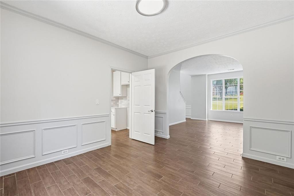 3318 Ridgemill Circle Dacula, GA 30019 - Photo 65 of 106 a view of empty room with wooden floor and fan