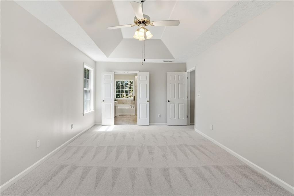 3318 Ridgemill Circle Dacula, GA 30019 - Photo 72 of 106 wooden floor in an empty room with a window