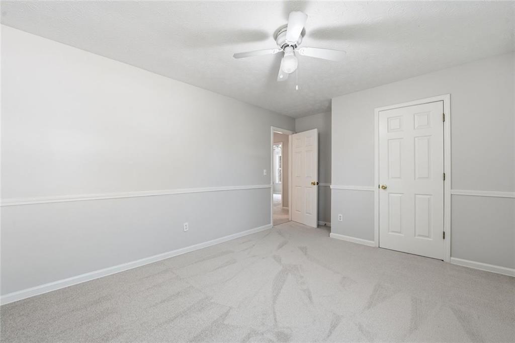 3318 Ridgemill Circle Dacula, GA 30019 - Photo 85 of 106 an empty room with a empty space and a ceiling fan