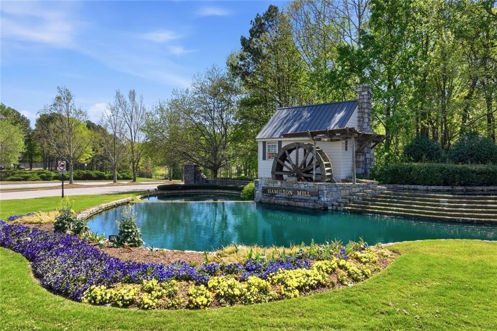 3318 Ridgemill Circle Dacula, GA 30019 - Photo 9 of 106 a view of a swimming pool with a garden