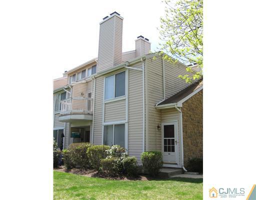 a view of a house with backyard and garden