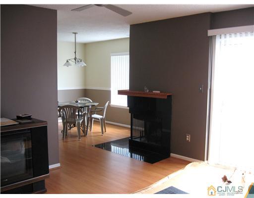 36 Farnham Square Sayreville, NJ 08859 - Photo 5 of 16 a living room with furniture and a fireplace