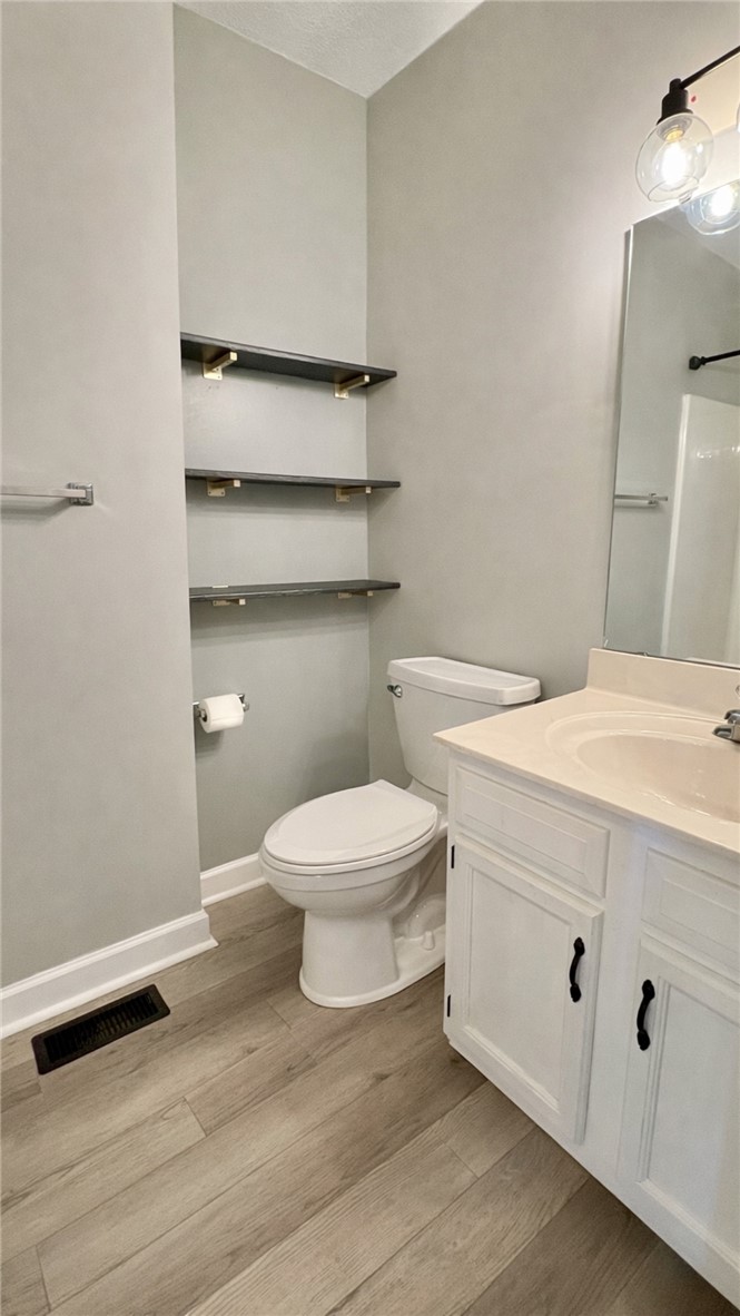 2301 Rolling Green Road Anderson, SC 29621 - Photo 13 of 32 This bright bathroom features a spacious vanity and sleek flooring, offering comfort and style.