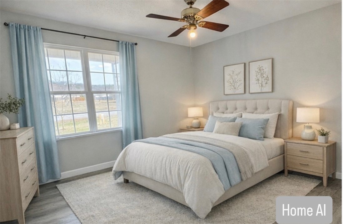 2301 Rolling Green Road Anderson, SC 29621 - Photo 14 of 32 This airy bedroom features large windows and a ceiling fan, offering comfort and light.