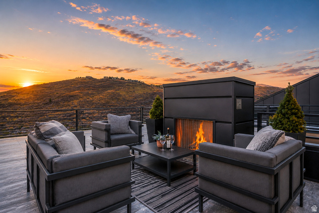1258 Rothwell Road Park City, UT 84060 - Photo 3 of 48 Rooftop terrace featuring a built-in fireplace, tile flooring, and metal railings
