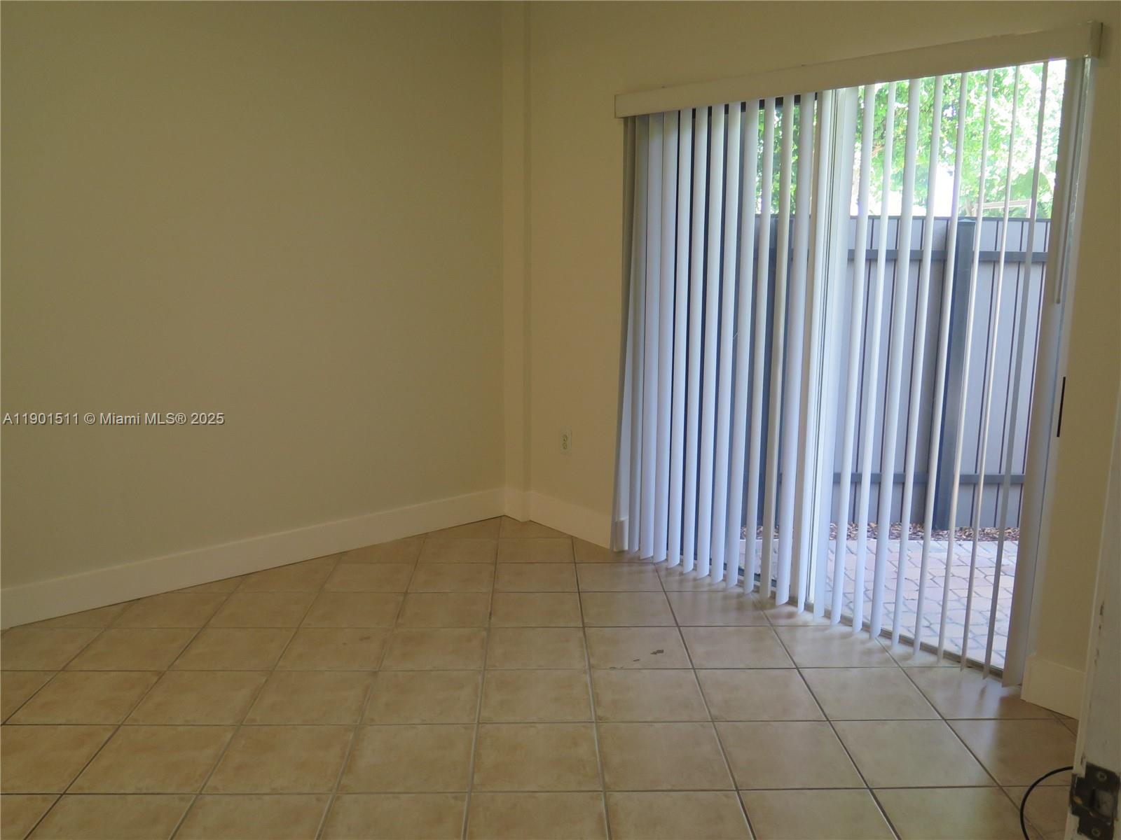 1918 Brickell Avenue, Unit 101 Miami, FL 33129 - Photo 11 of 21 a view of a livingroom with an empty space and floor to ceiling window