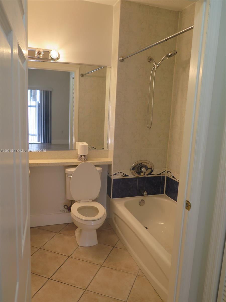 1918 Brickell Avenue, Unit 101 Miami, FL 33129 - Photo 13 of 21 a bathroom with a sink a toilet and shower