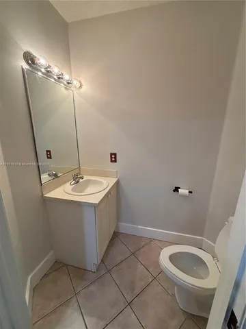 a view of backyard with wooden fence