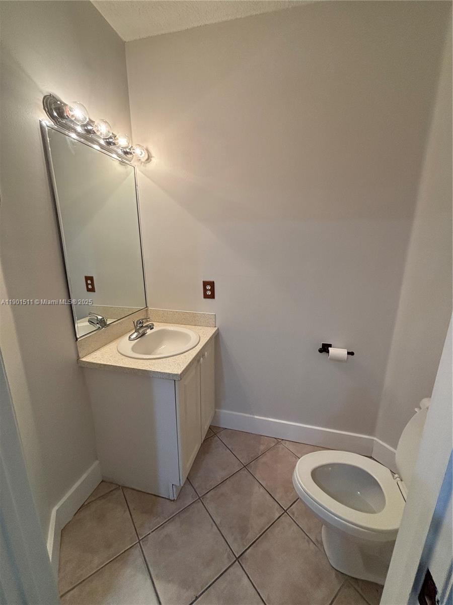 1918 Brickell Avenue, Unit 101 Miami, FL 33129 - Photo 14 of 21 a bathroom with a sink toilet and vanity