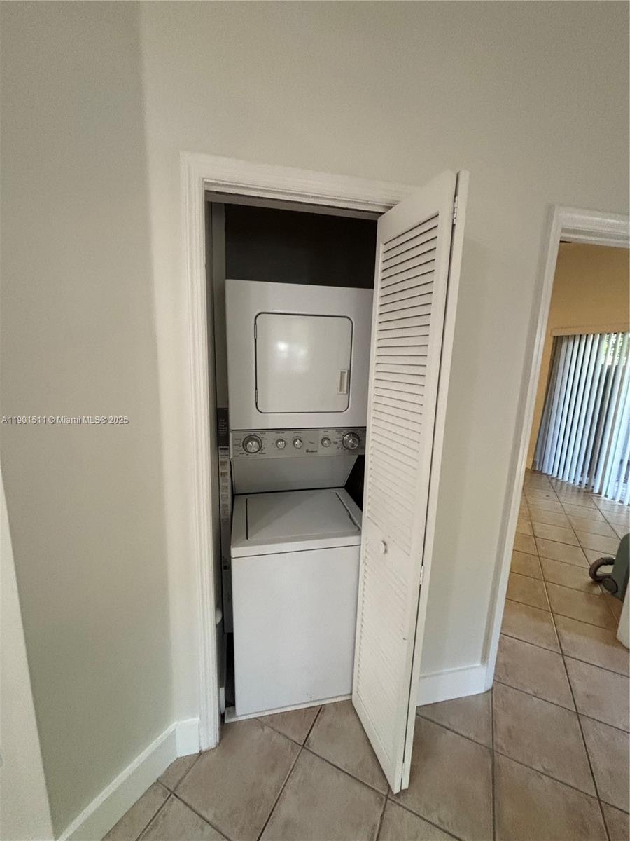 1918 Brickell Avenue, Unit 101 Miami, FL 33129 - Photo 15 of 21 a utility room with dryer and washer