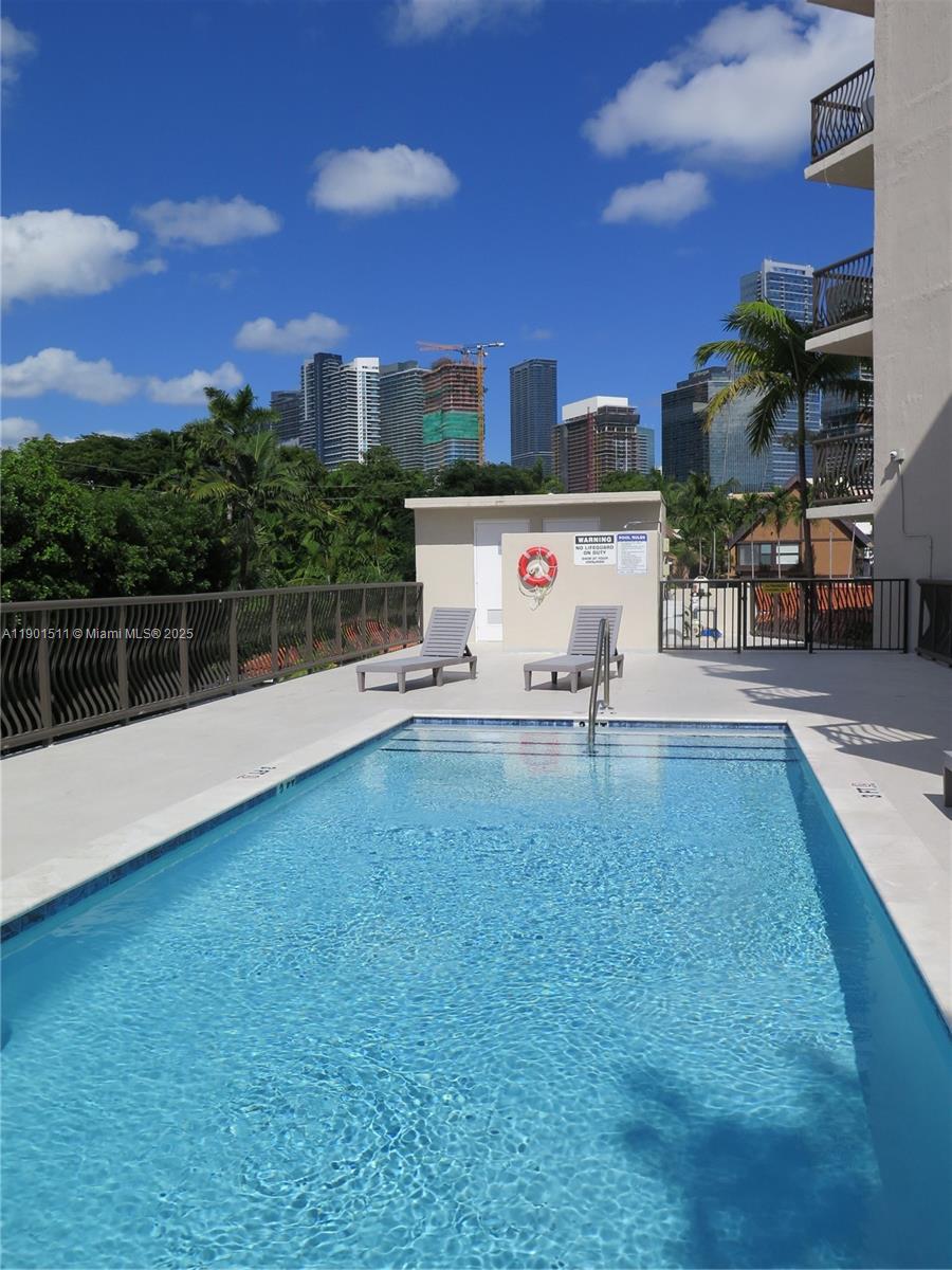 1918 Brickell Avenue, Unit 101 Miami, FL 33129 - Photo 19 of 21 a view of a terrace with a lake view