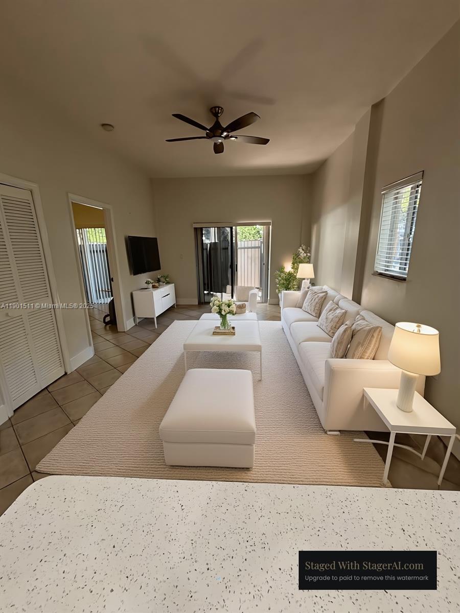 1918 Brickell Avenue, Unit 101 Miami, FL 33129 - Photo 3 of 21 a living room with furniture and a flat screen tv