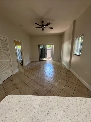 a view of a kitchen with a sink and cabinets