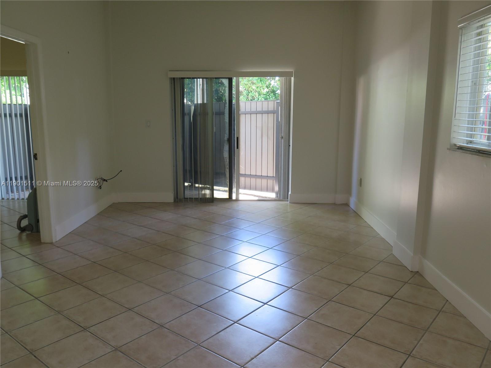 1918 Brickell Avenue, Unit 101 Miami, FL 33129 - Photo 9 of 21 an empty room with windows