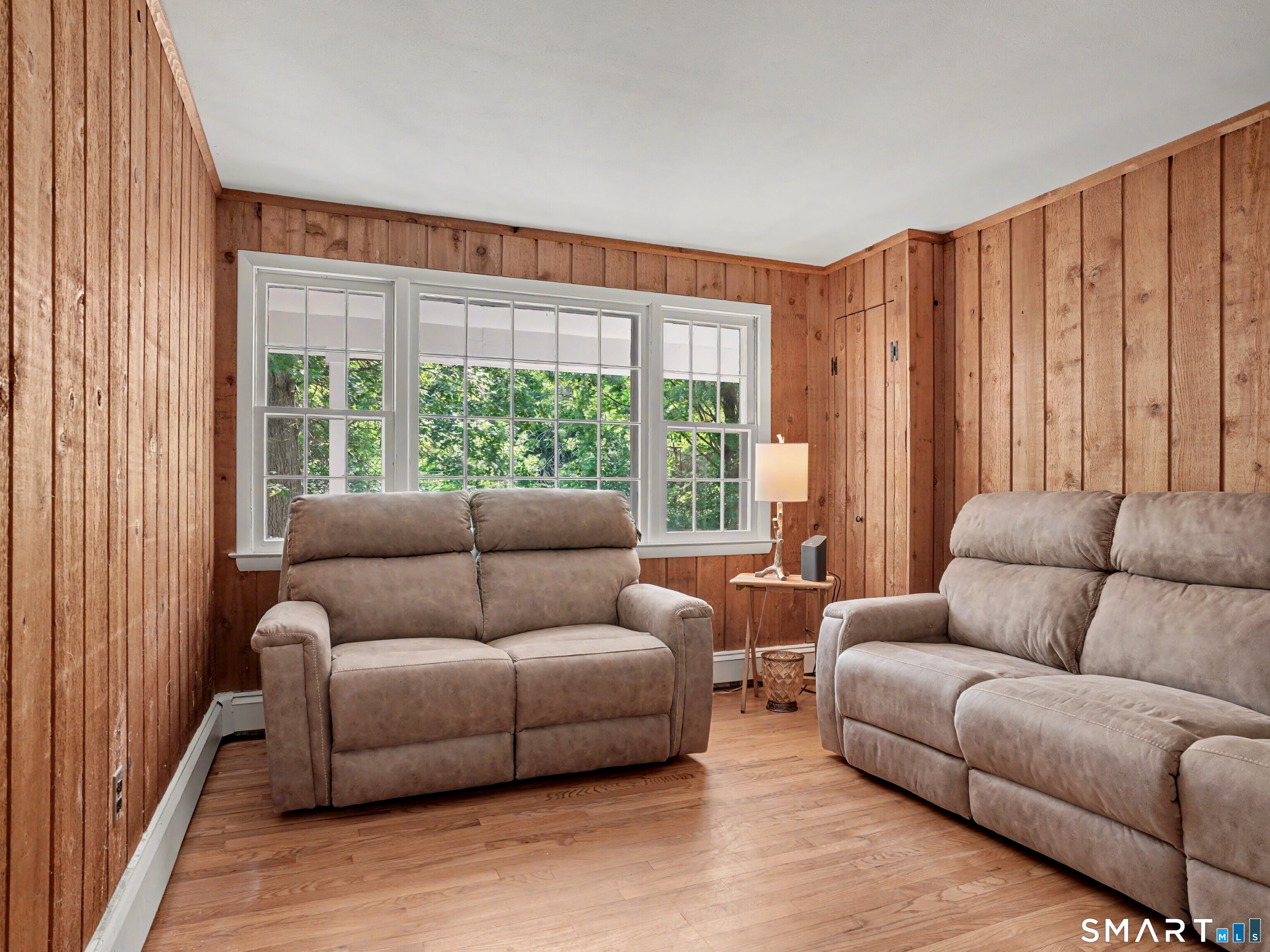 15 Flat Rock Drive Ridgefield, CT 06877 - Photo 17 of 39 a living room with furniture and a large window