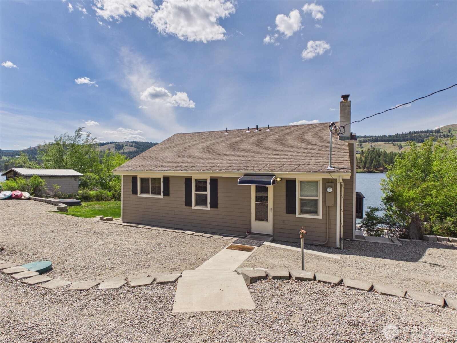 6 Marions Cove Road Republic, WA 99166 - Photo 17 of 33 a house view with a backyard space