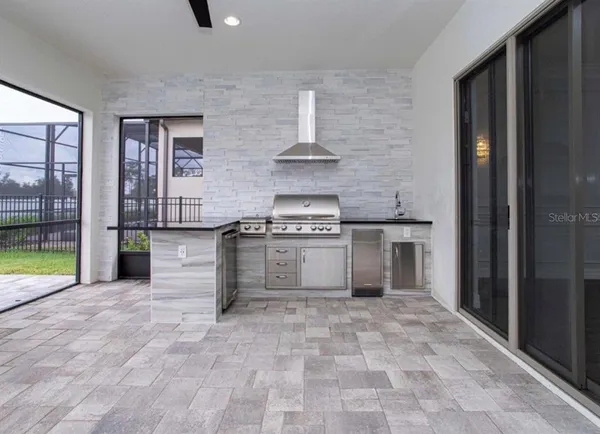 a bathroom with a toilet a sink a tub and mirror
