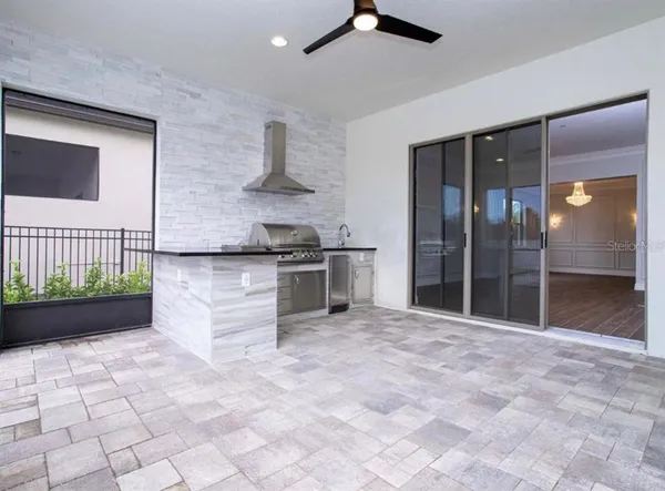 a bathroom with a sink a mirror and a shower