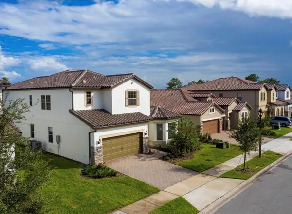 a aerial view of a house with a yard