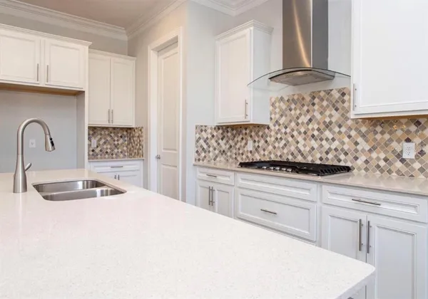 a view of a room that has a table and chairs in it