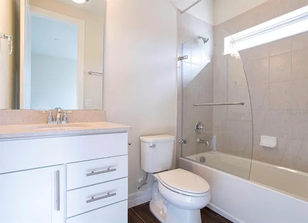 an aerial view of a house with a lake view