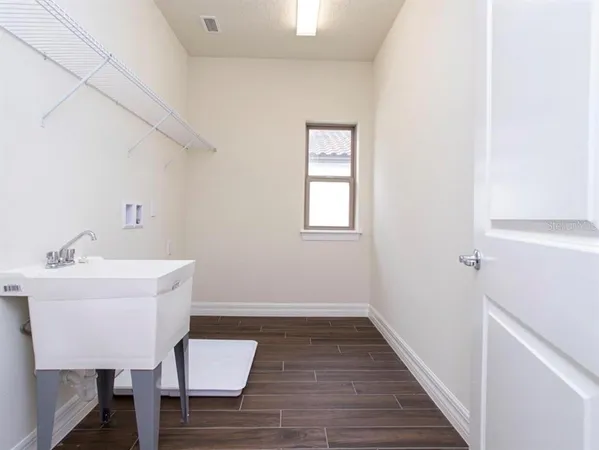 an aerial view of a house with a lake view