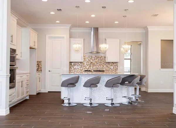 a bathroom with a granite countertop sink toilet a mirror and shower