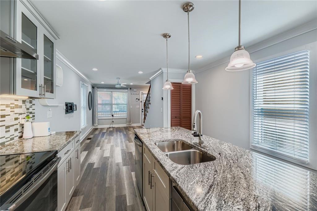 677 Ira Street Southwest Atlanta, GA 30310 - Photo 11 of 28 a kitchen with a sink stove and refrigerator