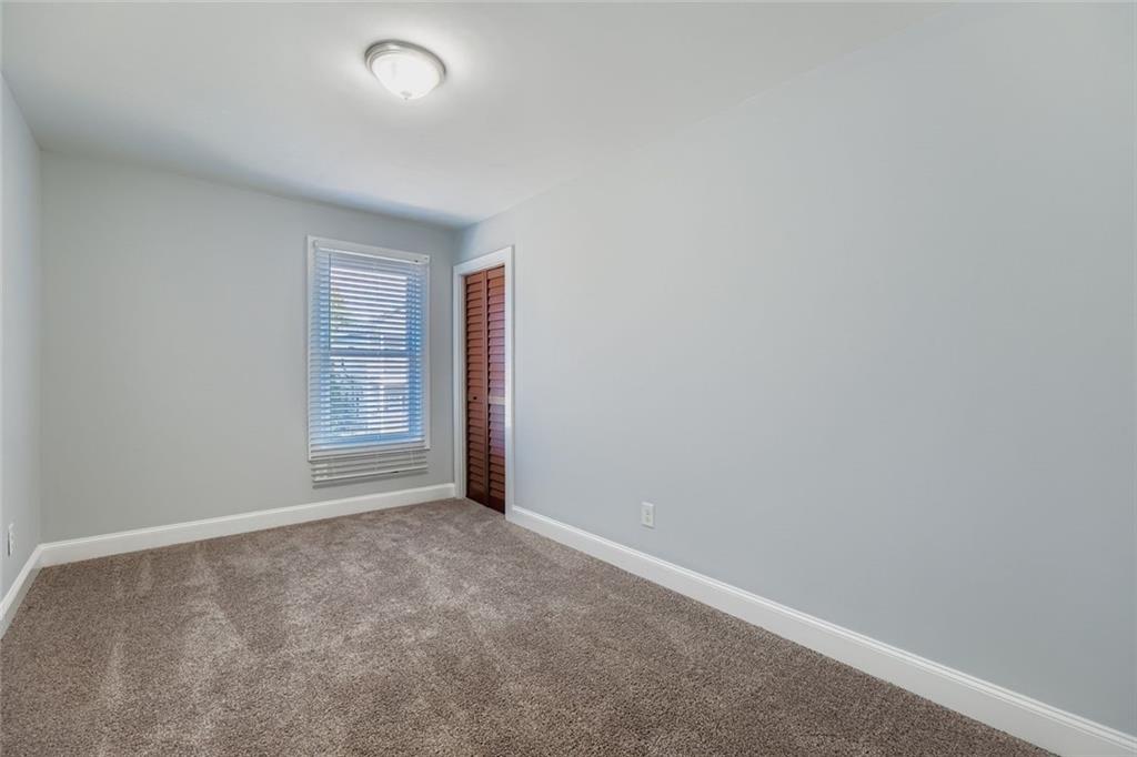 677 Ira Street Southwest Atlanta, GA 30310 - Photo 21 of 28 an empty room with windows