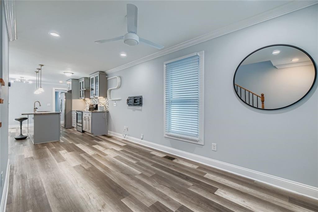 677 Ira Street Southwest Atlanta, GA 30310 - Photo 5 of 28 a view of a kitchen with furniture and a floor to ceiling window