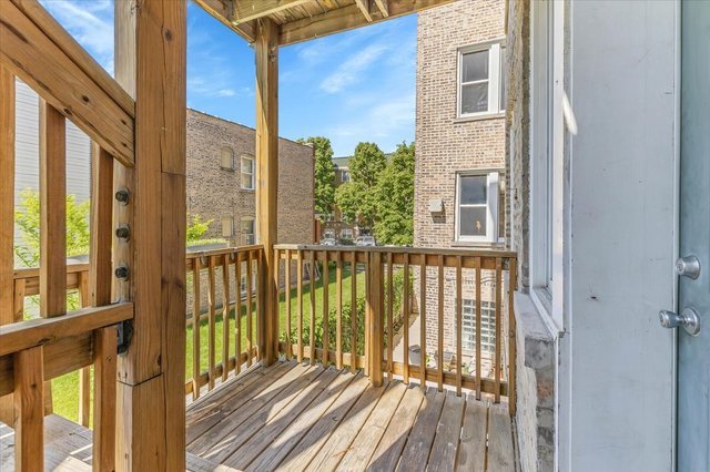 3317 West George Street, Unit 2 Chicago, IL 60618 - Photo 11 of 15 a view of a balcony with wooden floor